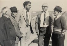 Who is with John Olsen on the jetty?