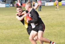 Hawks prevail in bottom-order battle