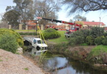Ute fished out with crane